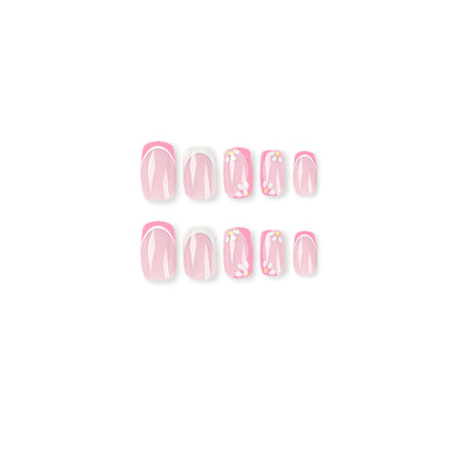 Kunstvolle Nagelkunst mit floralem Design und Glitzerakzenten Brehn
