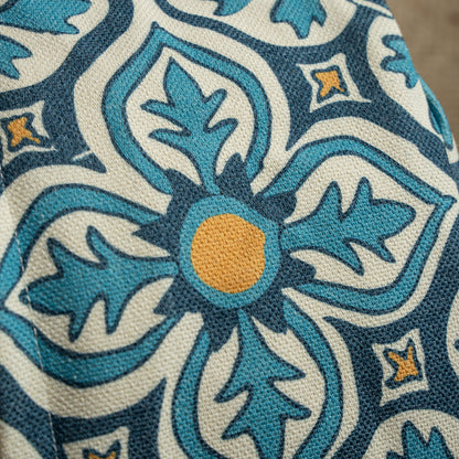 Rundes Sitzpouf mit gewebter Jacquard-Struktur und praktischem Tragegriff Brehn