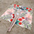 Stranddecke mit lebhaftem Blumenmuster und innovativer Struktur Brehn