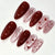 Dekoratives Press-On Nagelset mit Herz- und Schleifendesigns Brehn