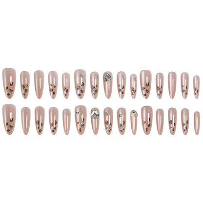 Glamouröses Kunstnagelset mit lustigem Leoparden-Muster und glitzernden Akzenten Brehn