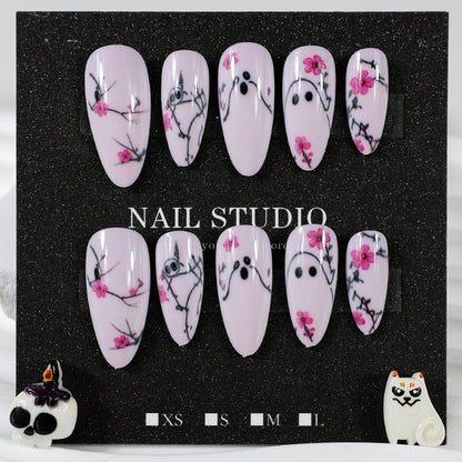 Kunstnagelset mit verspielten Geister- und Blumenmotiven Brehn