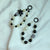 Elegante Perlen- und schwarze Perlen-Charm-Armband Brehn