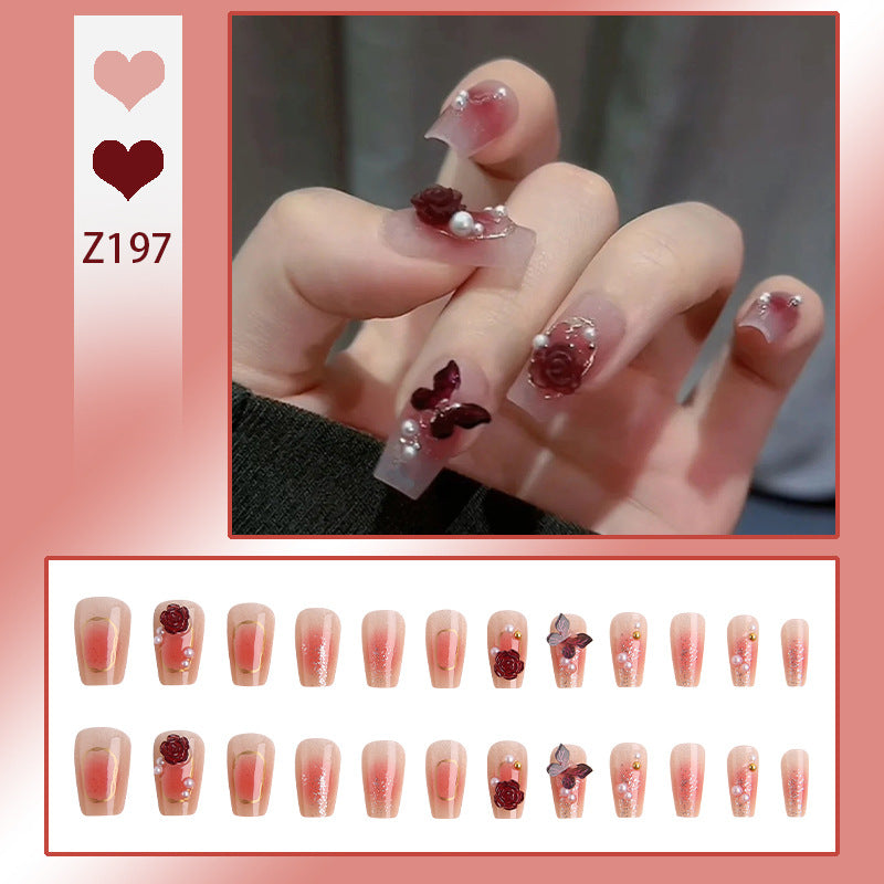Kunstnagelset mit eleganten 3D-Blüten- und Schmetterlingsverzierungen Brehn