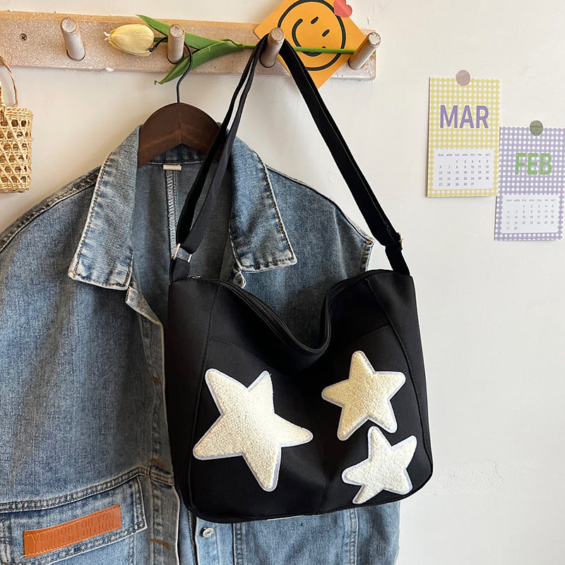 Lässige mit Sternen verzierte Schultertasche