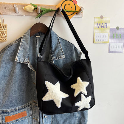 Lässige mit Sternen verzierte Schultertasche