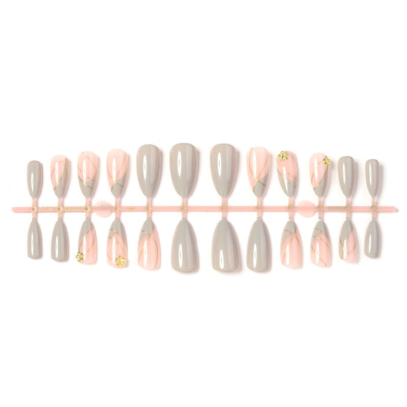 Kunstnagelset mit elegantem Marmor-Design und Goldakzenten Brehn