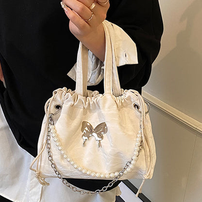 Elegante Mini-Handtasche mit Perlenakzenten und Kordelzug