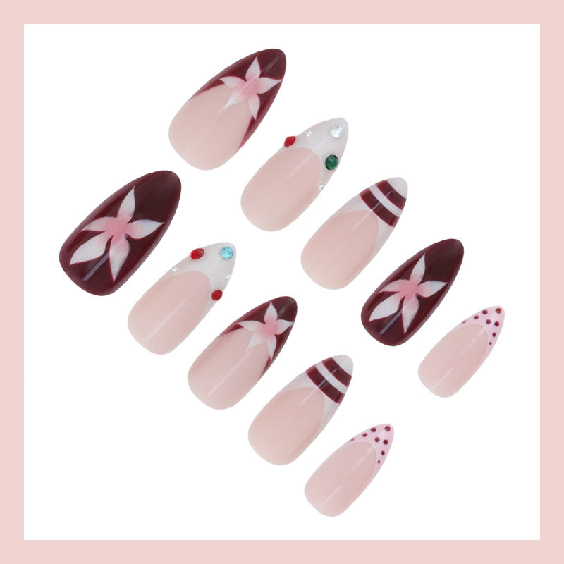 Kunstnagelset mit floralem Design und Glitzerakzenten Brehn