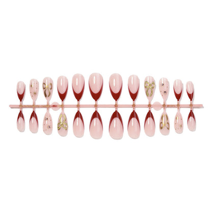 Kunstvolles Nagelset mit Glitzer- und Herzdesign Brehn