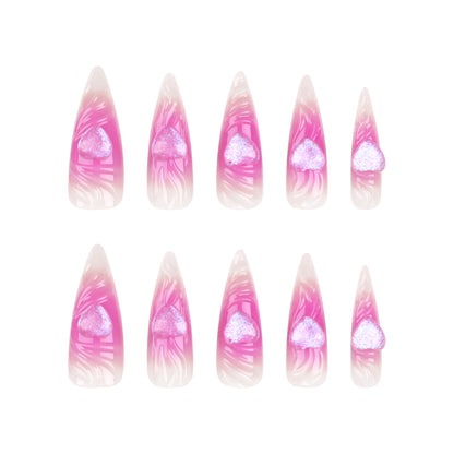 Kunstvolle Stiletto-Nägel mit Herz-Design und Glitzerakzenten Brehn