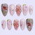 Kunstnagelset mit luxuriösen floralen Designs und Glitzerakzenten Brehn