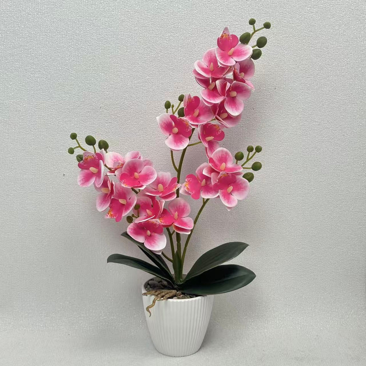 Lebensechte Orchideen Blumengesteck