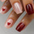 Kunstnagelset mit Herzmotiven und Glitzer Brehn