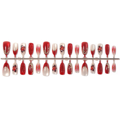 Kunstnagelset mit floralem Design und eleganten Glitzerdetails Brehn