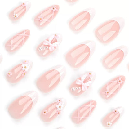 Kunstnagelset mit eleganten Schleifen und floralen Akzenten Brehn