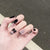 Elegante Stiletto Press-On Nail Set mit dekorativen Schleifenakzenten Brehn