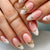 Kunstnagelset mit elegantem Goldrand und dekorativen Akzenten Brehn
