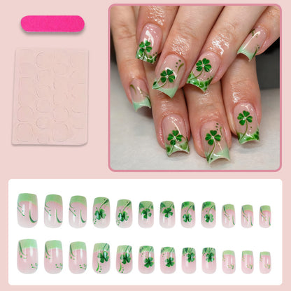Kunstnagelset mit festlichen Glitzer- und Kleeblatt-Motiven Brehn