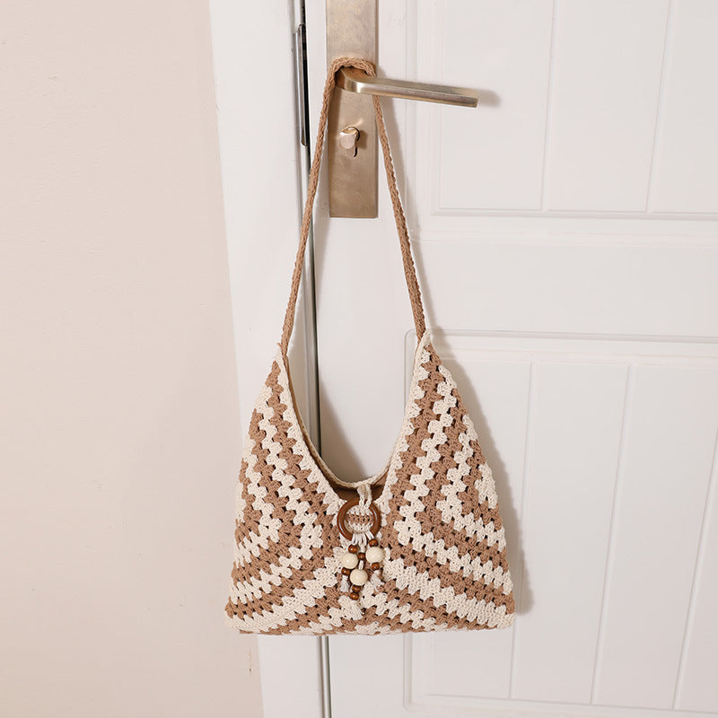 Damen Handtasche mit kunstvollem Flechtmuster Brehn