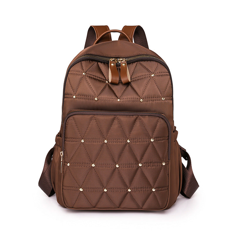 Stylische gesteppten Rucksack mit goldenen Akzenten