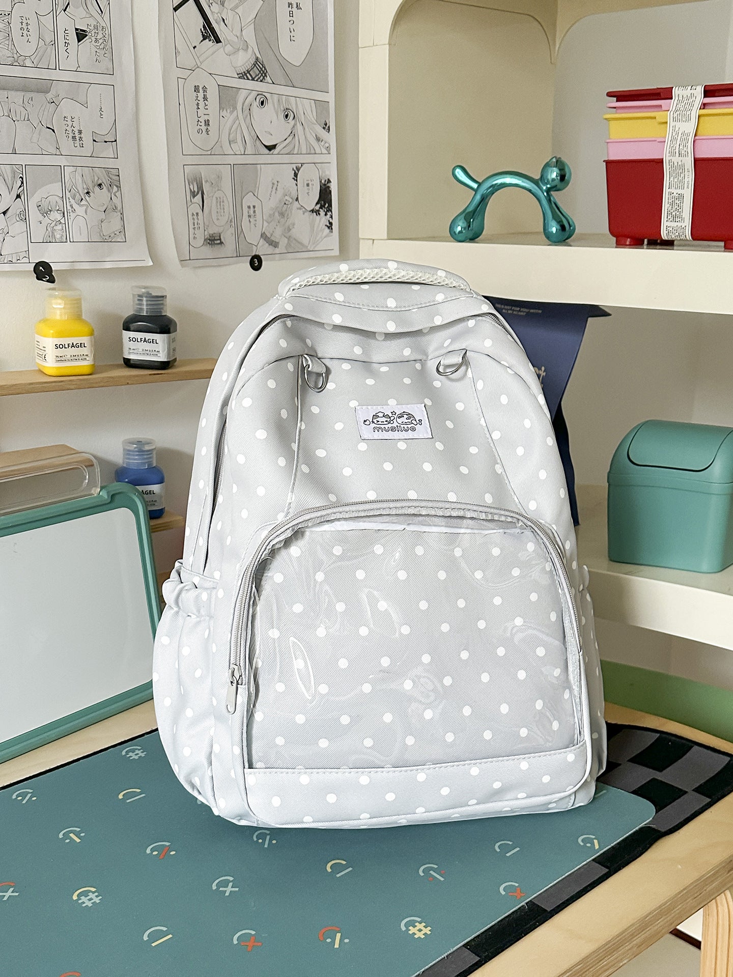 Lustiger gepunkteter Schulrucksack
