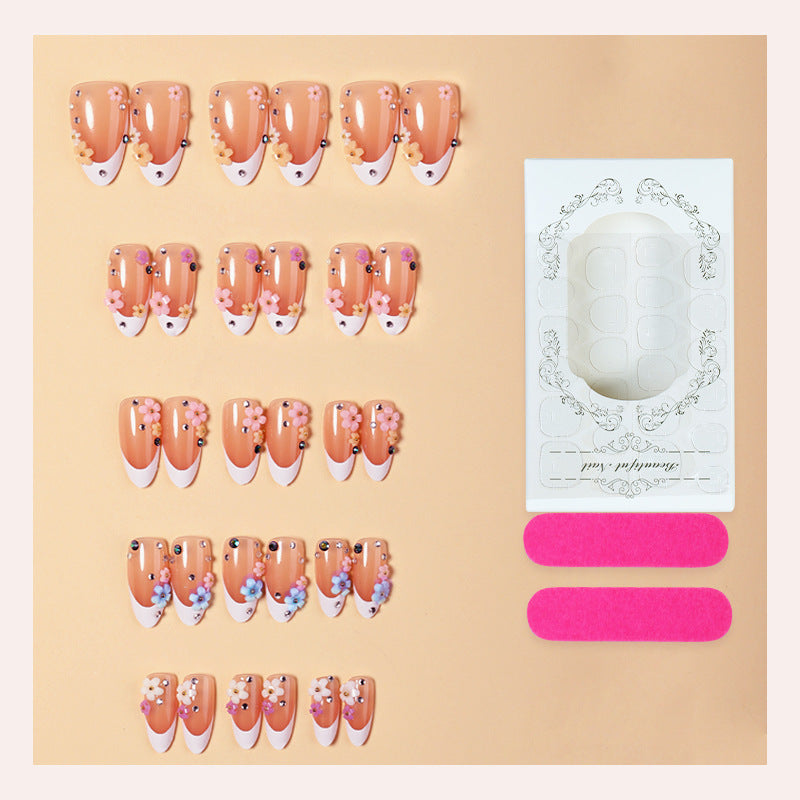 Dekorativer Press-On Nagelset mit floralen Verzierungen Brehn