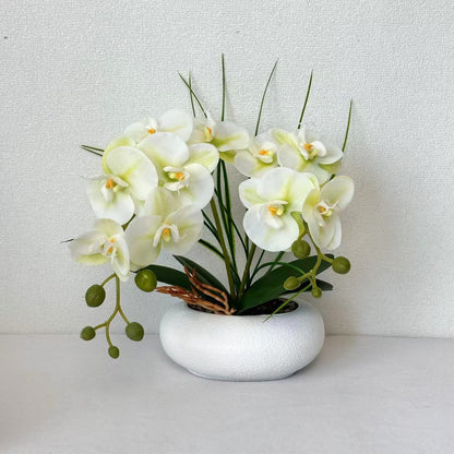 Lebensechte Orchideenblumenstrauß-Anordnung