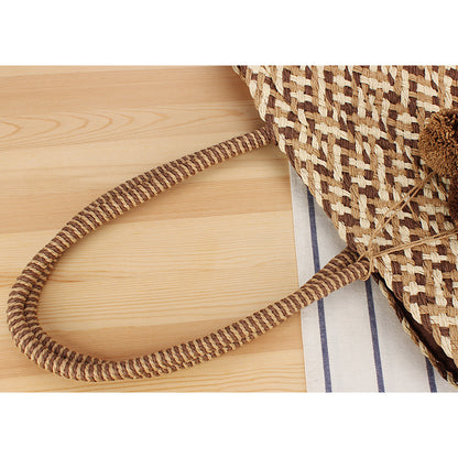 Sommerliche Bast-Handtasche mit Pompons Brehn
