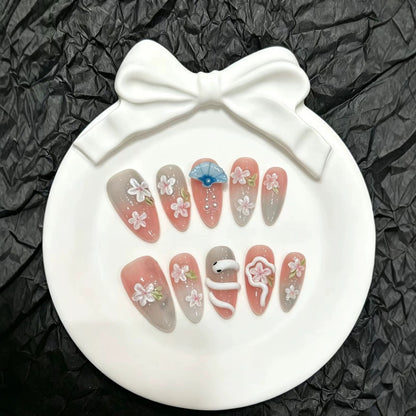 Dekoratives Druck-On-Nail-Art-Set mit floralen und Regenschirm-Akzenten