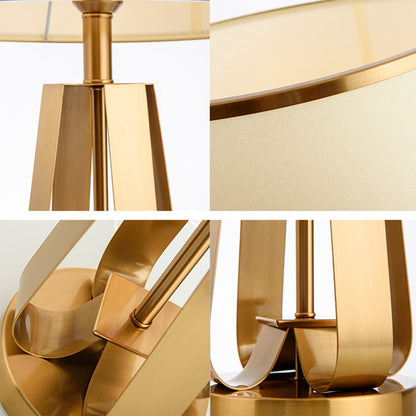 Elegante moderne Tischlampe mit skulpturaler goldener Basis