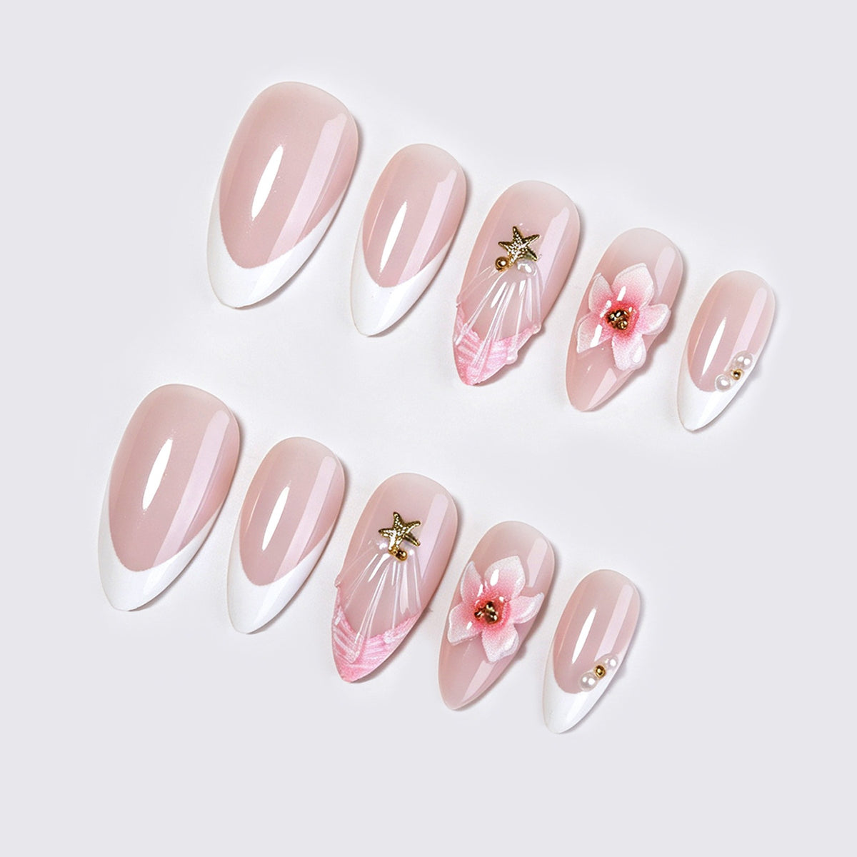 Kunstnagelset mit zarten Blüten- und Glitzerapplikationen Brehn