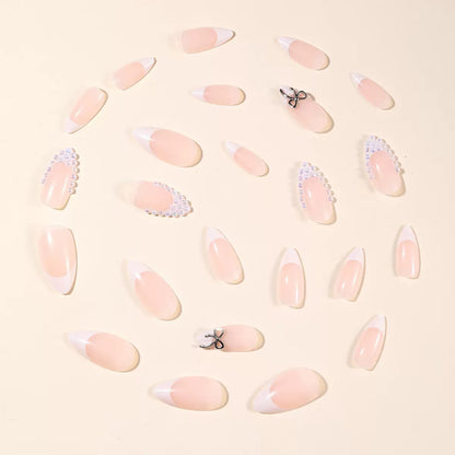 Kunstnagelset mit eleganten Perlen- und Schleifenverzierungen Brehn