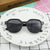 Damen geometrische Sonnenbrille mit transparenter Rahmenstruktur Brehn