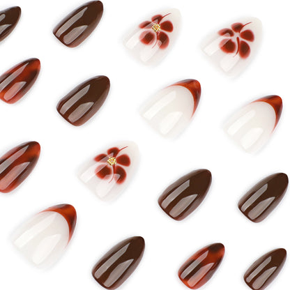 Kunstvolle Nagelverlängerungen mit eleganten floralem und glanzvollem Design Brehn