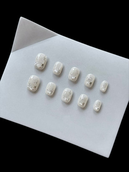 Dekoratives Press-On Nagelset mit himmlischen Motiven