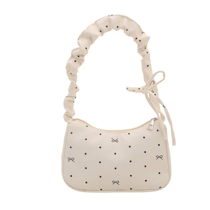 Süßes, mit Schleifen verziertes Mini-Handtasche
