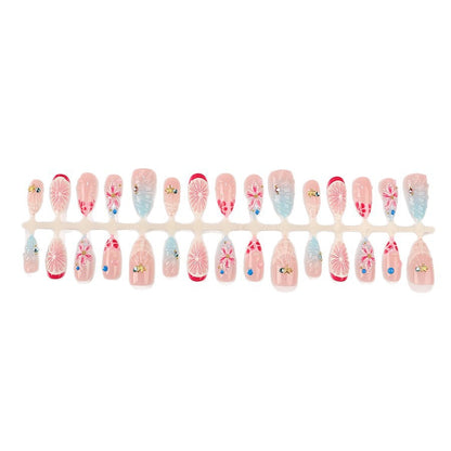 Kunstnagelset mit maritimen Motiven und luxuriösen Glitzerakzenten Brehn