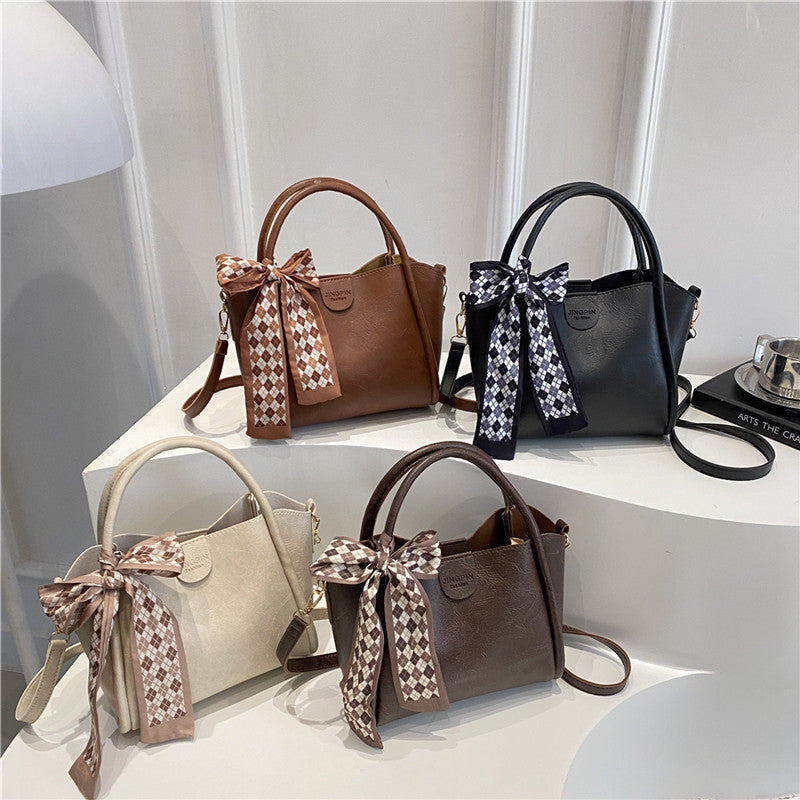 Elegante Schleifenakzent-Handtasche Brehn