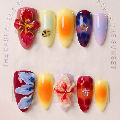 Kunstnagelset mit floralen 3D-Akzenten und bunten Designs Brehn