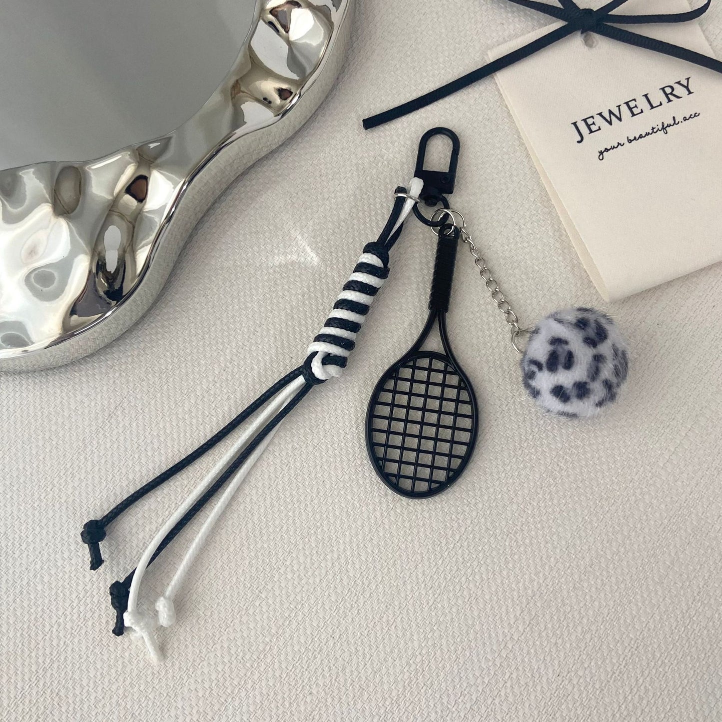 Tennisracket und Pelzball Schlüsselanhänger Brehn