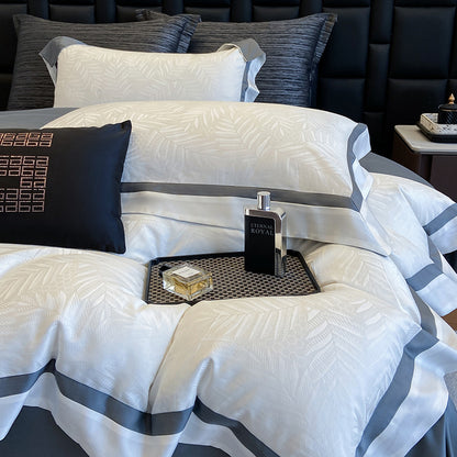 Premium-Bettwäscheset aus Baumwollsatin mit dezentem Blattmuster und feiner Kederkante