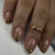 Kunstvolle Gel-Nagelkunst mit elegantem Gold-Tipp Brehn