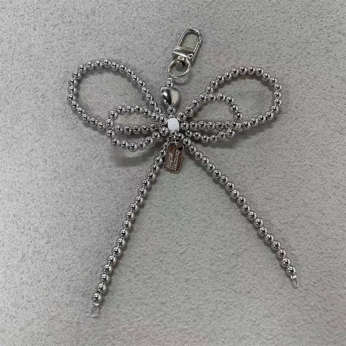 Elegante Perlenbogen Schlüsselanhänger Brehn