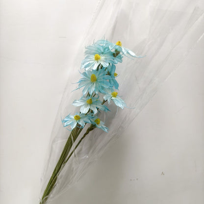 Vibrant künstlicher Blumenstrauß mit stilvoller Verpackung