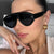 Damen moderne Fashion-Sonnenbrille im futuristischen Design Brehn