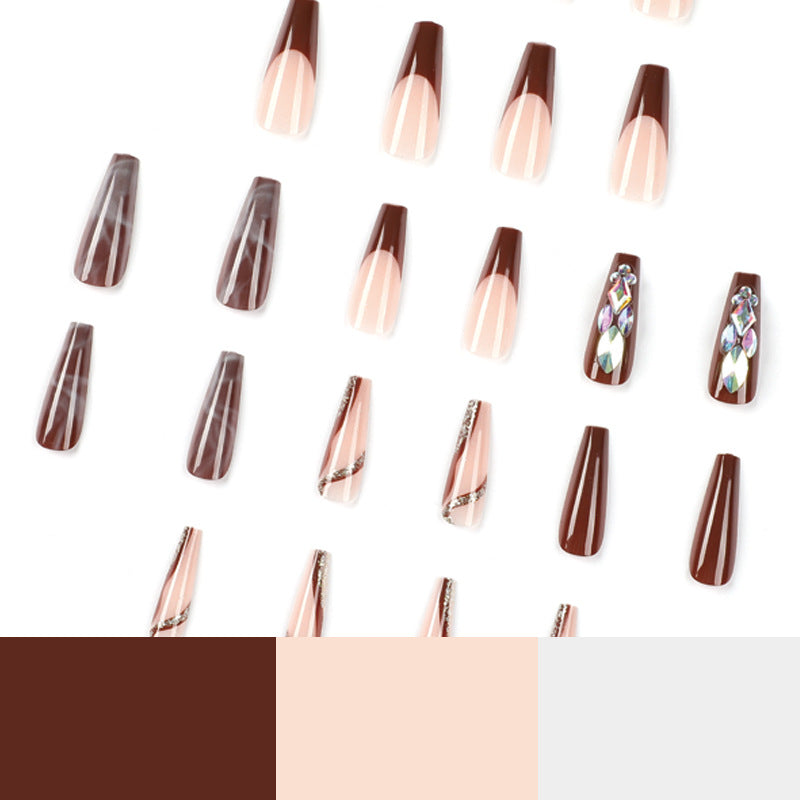 Künstliche Nagelverlängerungen mit eleganten Edelsteinverzierungen Brehn
