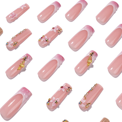Kunstvolle Nagelverlängerungen mit Strass- und Blütenverzierungen Brehn