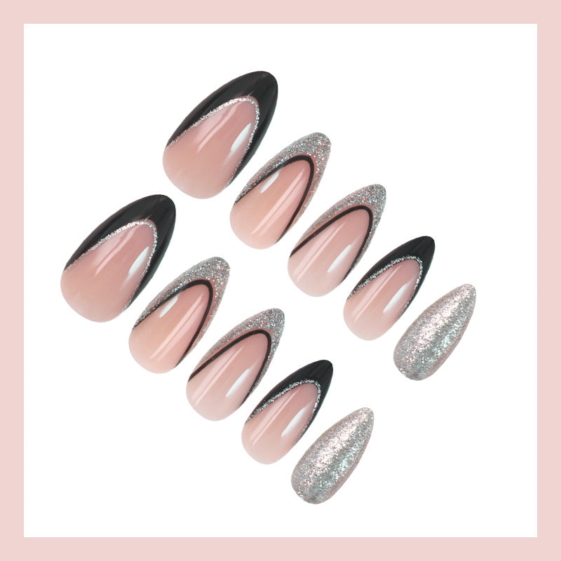 Kunstnagelset mit glamourösen Glitzerakzenten und elegantem Schwarz Brehn