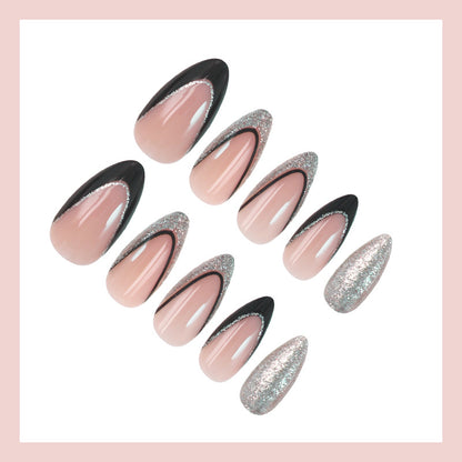 Kunstnagelset mit glamourösen Glitzerakzenten und elegantem Schwarz Brehn